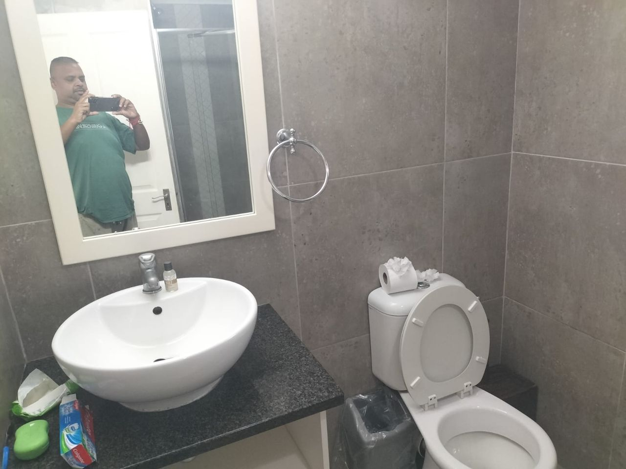 En-suite bathroom with shower and basin at a partner guest house