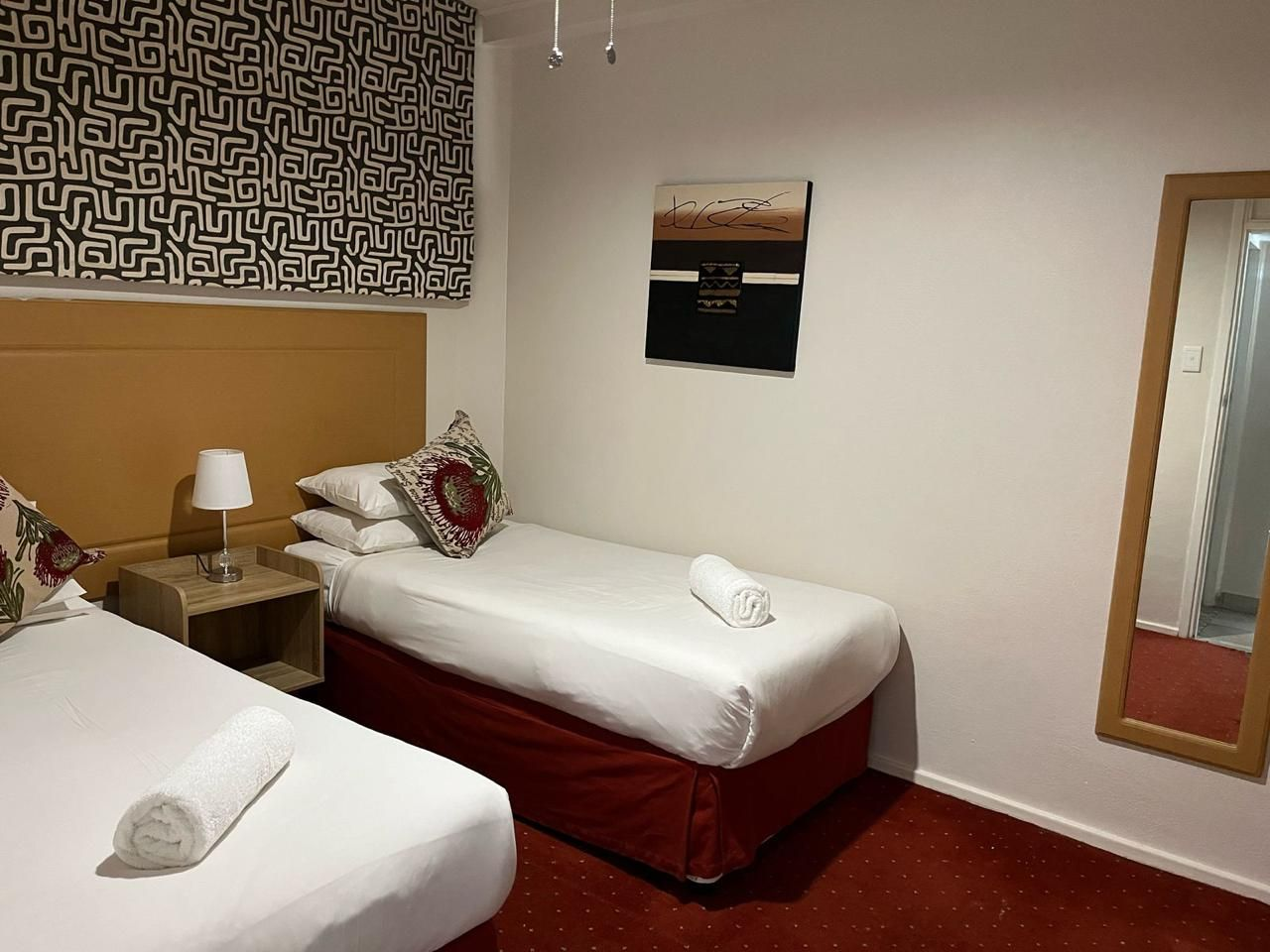 Twin room with fresh linen at a partner guest house