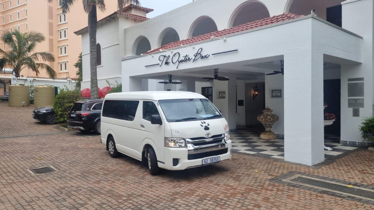 Toyota Quantum minibus parked outside The Oyster Box hotel
