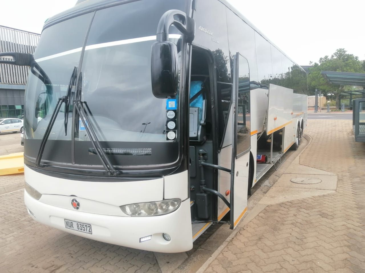 Luxury King Shaka tour coach with its luggage bay open
