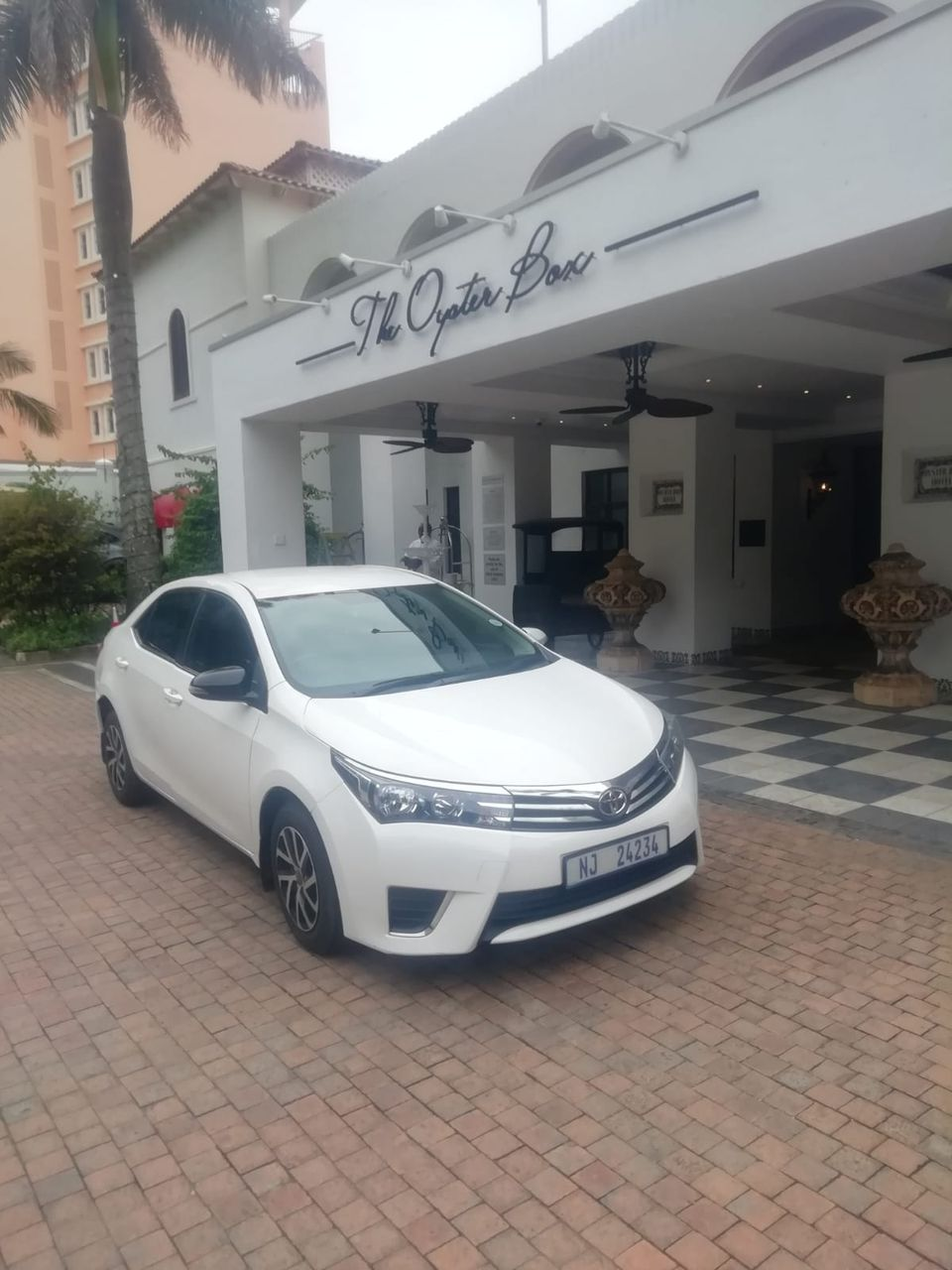 Sedan parked at The Oyster Box hotel in Umhlanga